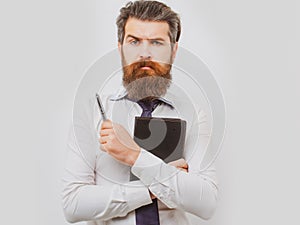 Business man is thinking about something with pencil. Business dreams. Thoughtful young man in shirt and tie holding