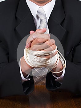 Business man tied hands