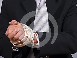 Business man tied hands