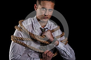 Business man tied up with rope