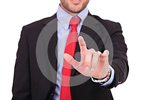 Business man touches imaginary screen