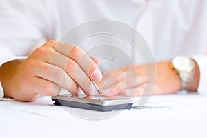 Business man with a touchscreen mobile