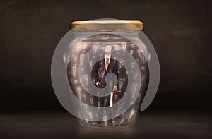 Business man trapped in jar with exclamation marks concept