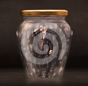 Business man trapped in jar with exclamation marks concept