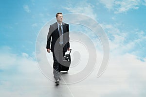 Business man travel the sky background clouding computing concept photo