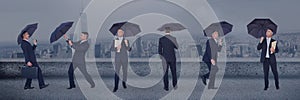 Business man with umbrella collage against city background