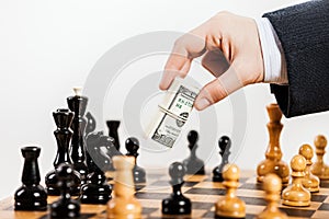 Business man unfair playing chess game