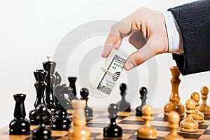 Business man unfair playing chess game photo