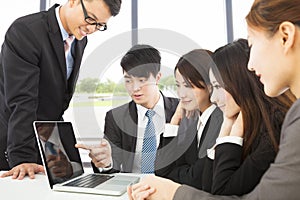 Business man use laptop to present report to colleague