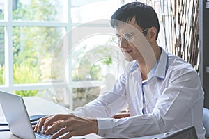 Business man using computer working at home