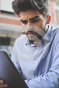 Business man using iPod.