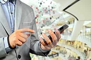 Business Man using Mobile Cell Phone in The Modern office buildi