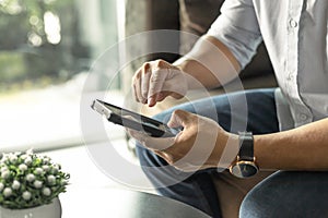 Business man using mobile phone to communicate business.