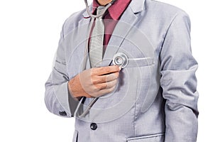 Business man using stethoscope checking his heart