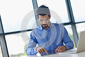 Business man using tablet compuer at office