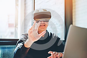 Business man using Virtual Reality simulator headset and develop