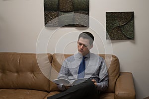 Business Man Waits in Reception Area