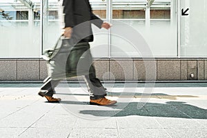 Business Man Walking at day