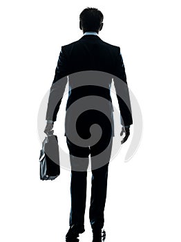 Business man walking rear view silhouette