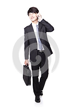 Business man Walking and speaking mobile phone