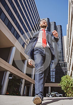 Business man walking on the street. Businessman walk near modern office center.