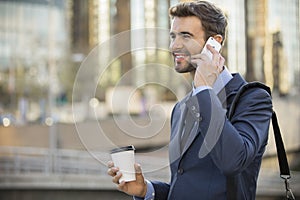 Business man walking talking on cell phone