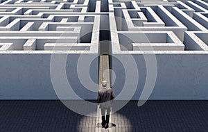 Business man walking to challenge an endless maze, conceptual image representing business strategy