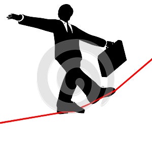 Business man walks risky high tightrope from below