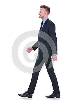 Business man walks to side