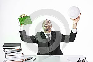 Business man watching the game on line at work