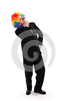 Business man wearing colorful clown wig