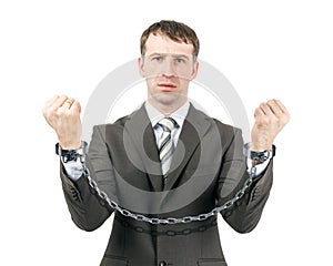 Business man wearing suit in handcuffs