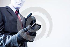 Business man in white mask wearing gloves and using mobile phone