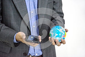 Business man wiht earth globe and moblie phone isolate on white