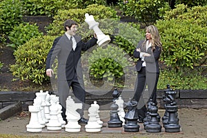 Business man winning at chess