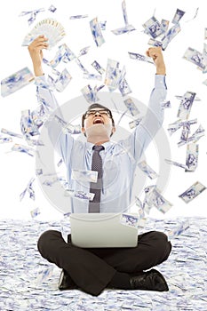 Business man winning a lottery with money rain background