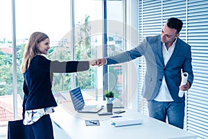 Business man and woman business couple fist bump hand together f