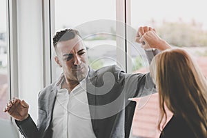 Business man and woman couple fist bump hand together f