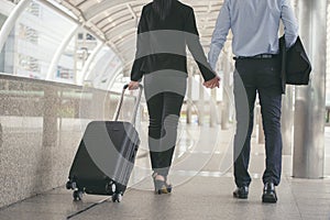 Business man and woman Dragging suitcase luggage bagrist men and