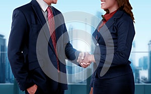 Business man and woman get deal with shaking hand