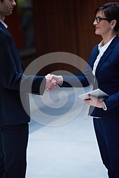 Business man and woman hand shake