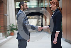Business man and woman hand shake photo