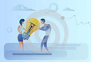 Business Man And Woman Holding Light Bulb Sharing New Creative Idea Concept