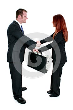 Business Man and Woman Shaking Hands Over Briefcase of Money