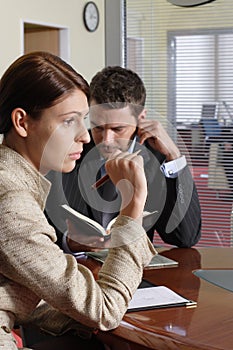 Business man and woman talking in the office