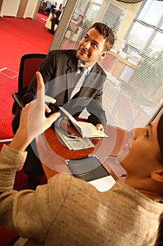 Business man and woman talking in the office