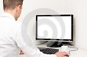 Business man working behind a computer with white screen