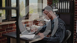 Business man working on commercial report in startup office