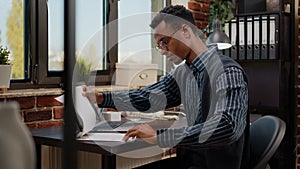 Business man working on commercial report in startup office