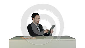Business man working on digital tablet on his table in his office on white background isolated